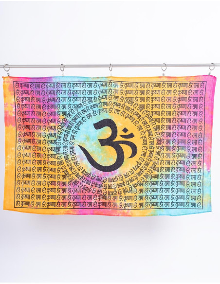 Handmade tapestry of the Om symbol on a multicolored background using tie-dye technique